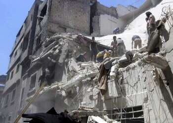 Report: At least 6 killed as Syrian air raids hit crowded residential area