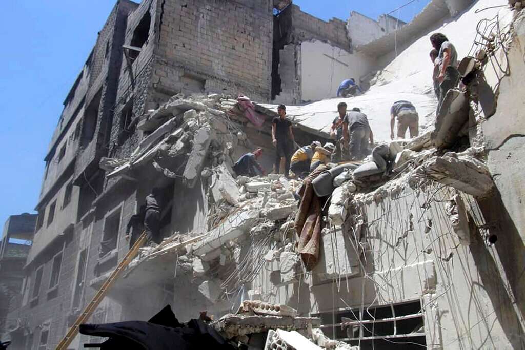 Report: At least 6 killed as Syrian air raids hit crowded residential ...