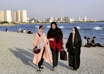 In Iran, some take off their hijabs as hard-liners push back