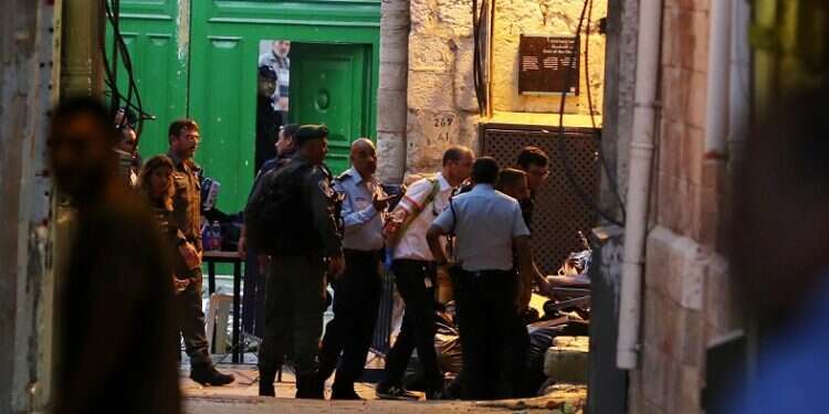 Police officer wounded in J'lem stabbing; terrorist shot dead