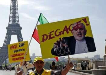 Iranian FM Zarif talking to French counterpart at G-7 summit