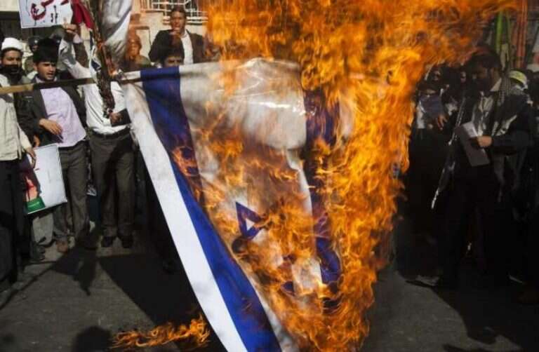 Report: German parties block bill barring setting fire to Israeli flag