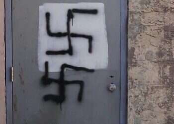 Who defaced a Jewish-owned business in New Jersey with anti-Semitic graffiti?