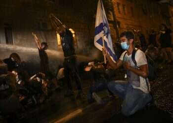 Anti-government protesters clash with police in Jerusalem, Tel Aviv