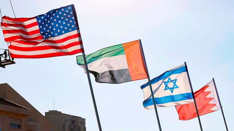 A road is decorated with the flags of (L-R) the US, the United Arab Emirates, Israel and Bahrain, in the resort city of Netanya in central Israel, on September 13, 2020