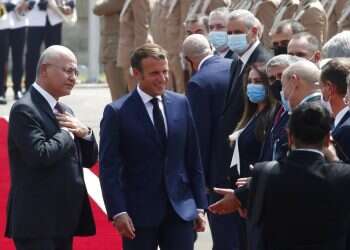 French leader in Baghdad, urges Iraqis to guard sovereignty