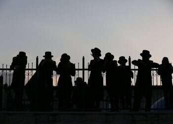 Health Ministry struggles with obstinate Haredi enclaves as leading rabbi tests positive