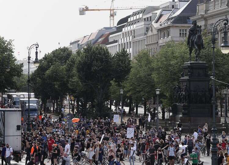 Germans participate in a rally against coronavirus regulations