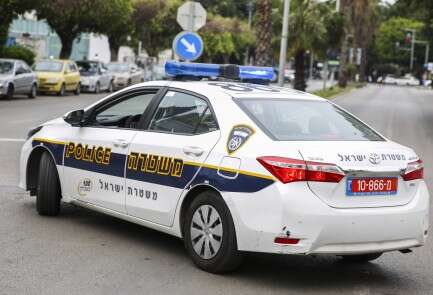 Israel Police Officer and Police Car - Police Chief Magazine