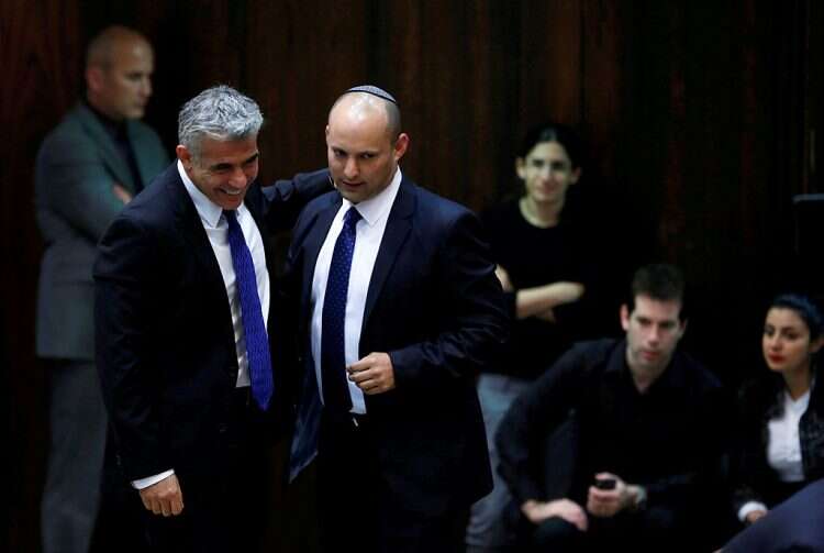 Yesh Atid leader Yair Lapid and Yamina chief Naftali Bennett at the Knesset