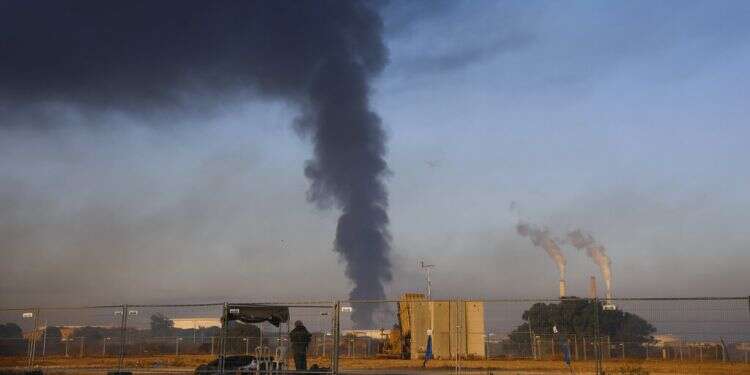 Huge fire at petroleum facility caused by rocket hit nearly out