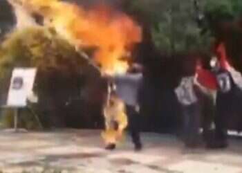 Iranian tries to burn Israeli flag, sets himself on fire