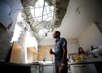 Ashkelon family holds on after rocket hits their home