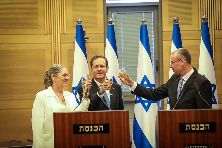 Israeli President-elect Isaac Herzog (center), his wife Michal Herzog, and Knesset Speaker Yariv Levin at the Knesset on Wednesday