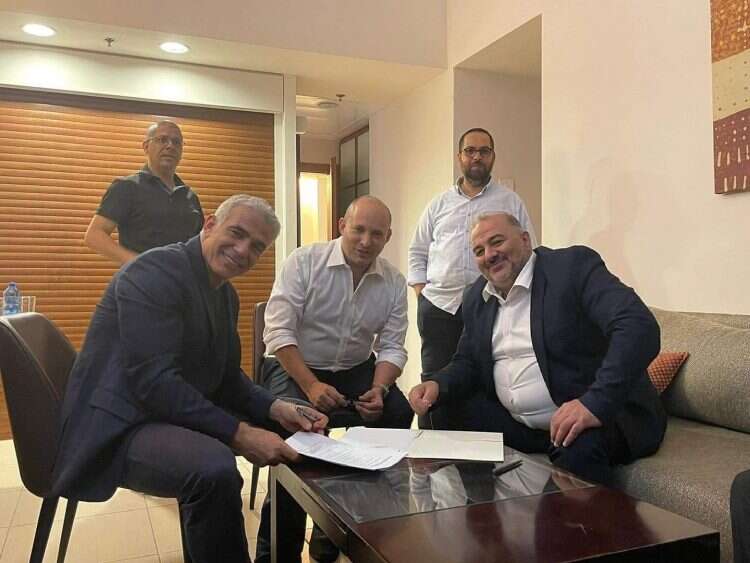 Yesh Atid leader Yair Lapid, Yamina Chairman Naftali Bennett, and Ra'am leader Mansour Abbas after finalizing the coalition agreements, June 2, 2021