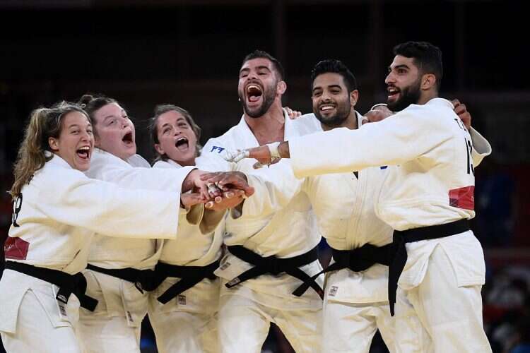 Team Israel celebrates winning the judo mixed team's bronze medal at the Tokyo Olympic Games, July 31, 2021