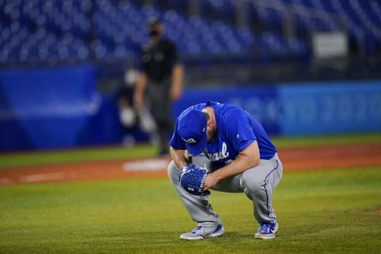 Israel's Jeremy Bleich reacts after hitting two South Korea batters in a row in the tenth inning of a baseball game at the 2020 Summer Olympics, July 29, 2021