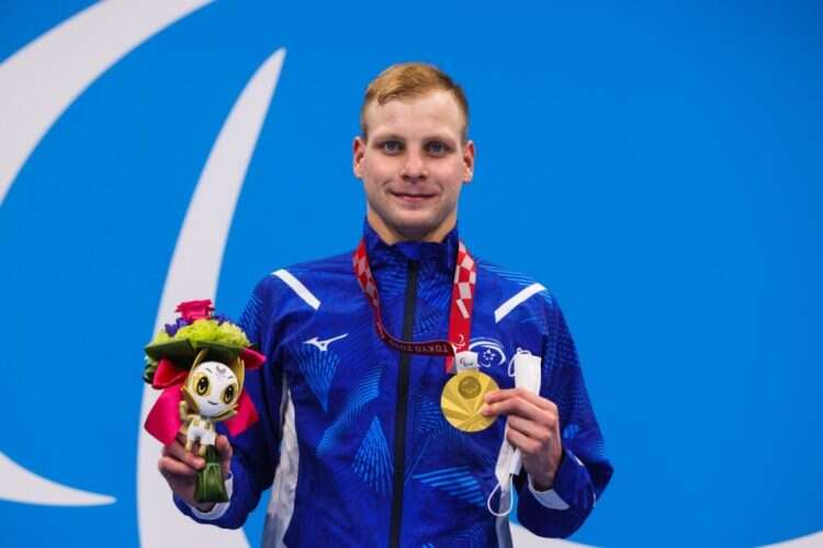 Israeli Paralympic swimmer Mark Malyar receives the gold medal in the men's 200-meter individual medley in the Tokyo Games, Aug. 27, 2021