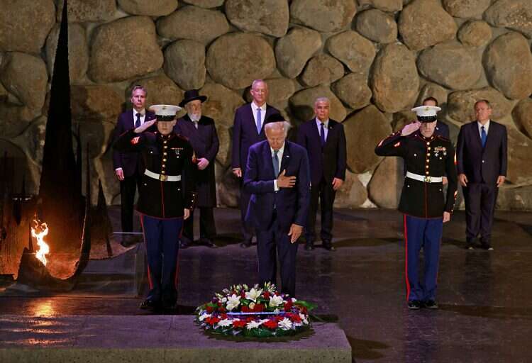 US President Joe Biden pays respect after laying a wreath during his visit to the Yad Vashem Holocaust Remembrance Center in Jerusalem, July 13, 2022