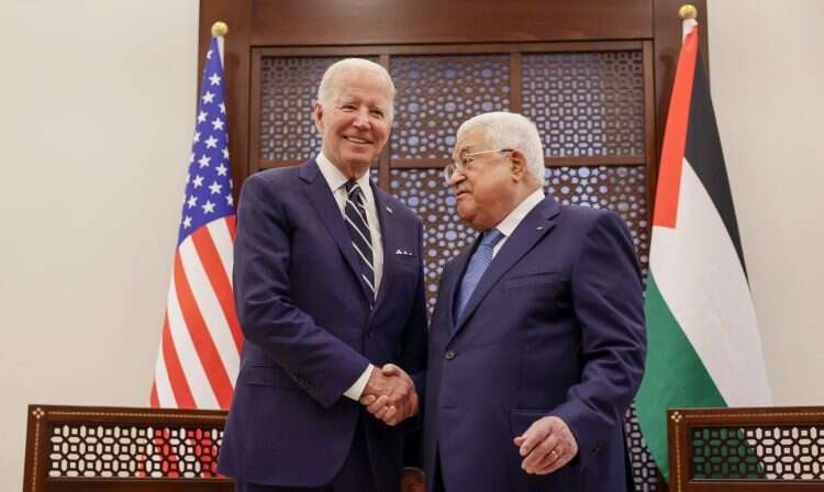 US President Joe Biden shakes hands with Palestinian Authority President Mahmoud Abbas at the Presidential Compound, in Bethlehem on July 15, 2022