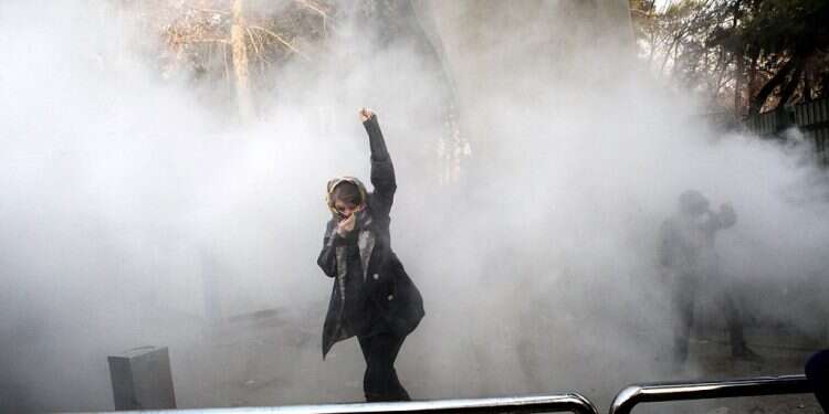 Clashes at Tehran university after female students enter hall without hijabs