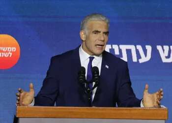 Defiant Lapid vows to 'wait patiently' for final tally after apparent defeat