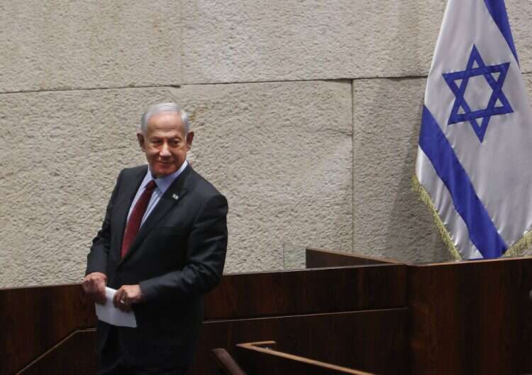 Then-Prime minister-designate Benjamin Netanyahu looks on after a speech in the Knesset