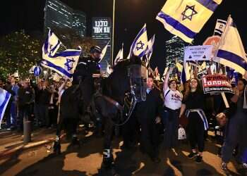 Israel Police claim protester beaten by mounted officer had attacked his horse