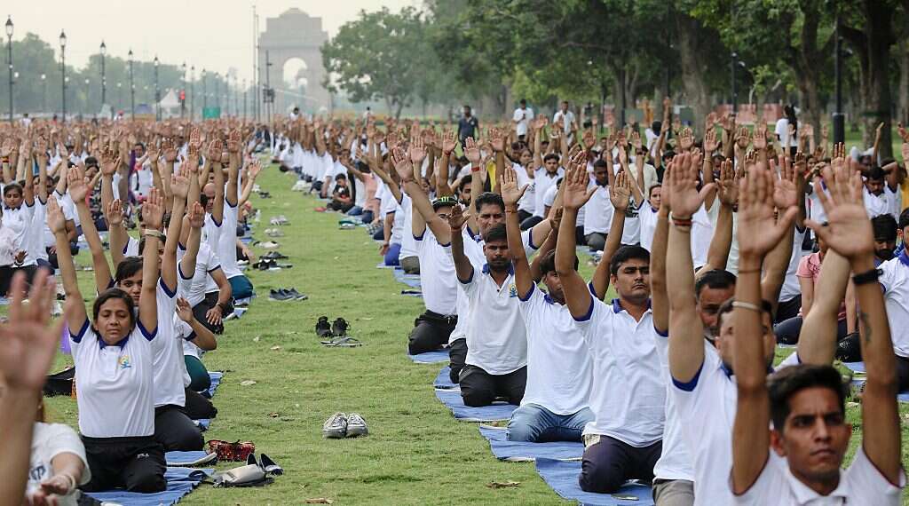 India's president starts US visit with yoga on UN lawn –