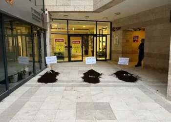 Left-wing groups display fake graves in protest of settler violence