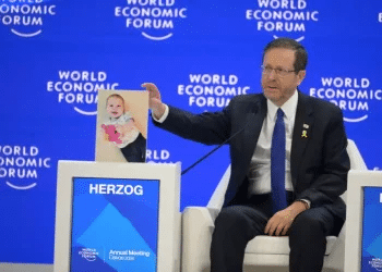 A hostage for a third of his life: Herzog displays Bibas' photo at World Economic Forum to mark sad birthday
