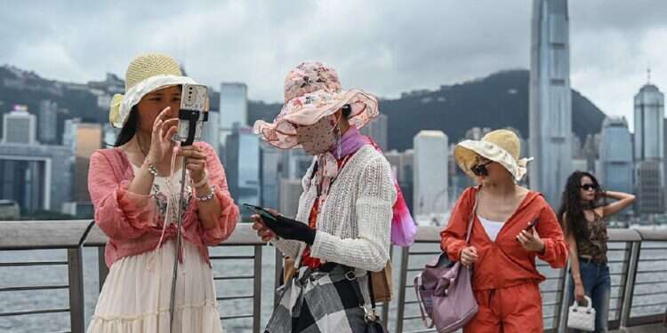 Hong Kong tells residents: Smile