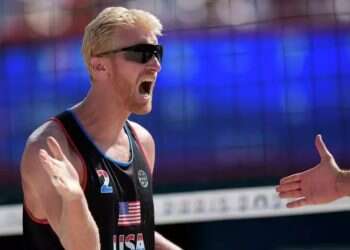 Chase Budinger celebrates a point against France in a beach volleyball match at the 2024 Olympics