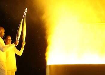 Marie-José Pérec and Teddy Riner light the Olympic Cauldron at the Paris 2024 opening ceremony