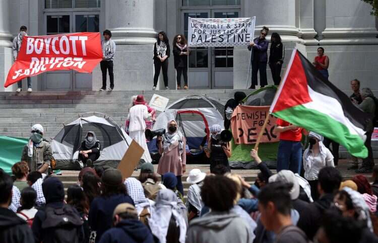 Pro-Palestinian protesters set up a tent encampment during a demonstration in front of Sproul Hall on the UC Berkeley campus on April 22, 2024 in Berkeley, California