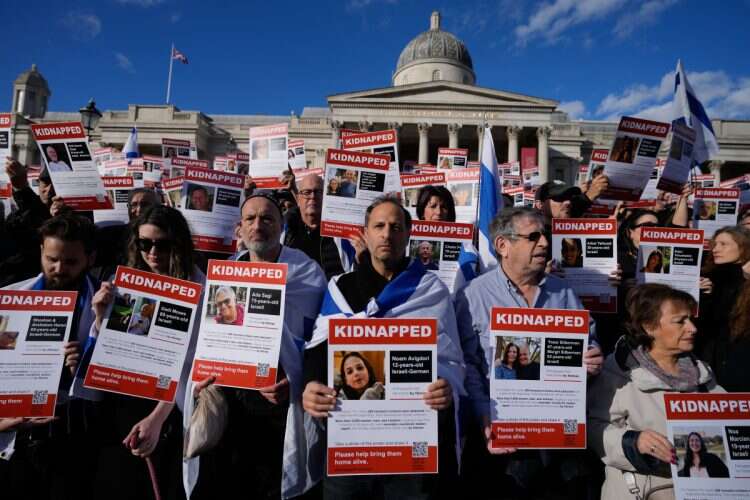 Israeli supporters show placards with the faces and names of people taken hostage and held in Gaza, during a protest in Trafalgar Square, London, Sunday, Oct. 22, 2023 (Photo: AP/Frank Augstein)