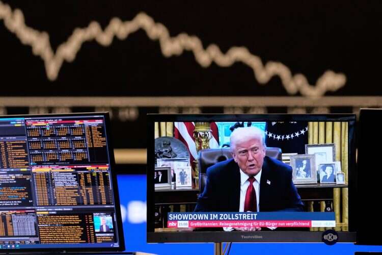 Us President Donald Trump appears on a television screen at the stock market in Frankfurt, Germany, Wednesday, April 2, 2025
